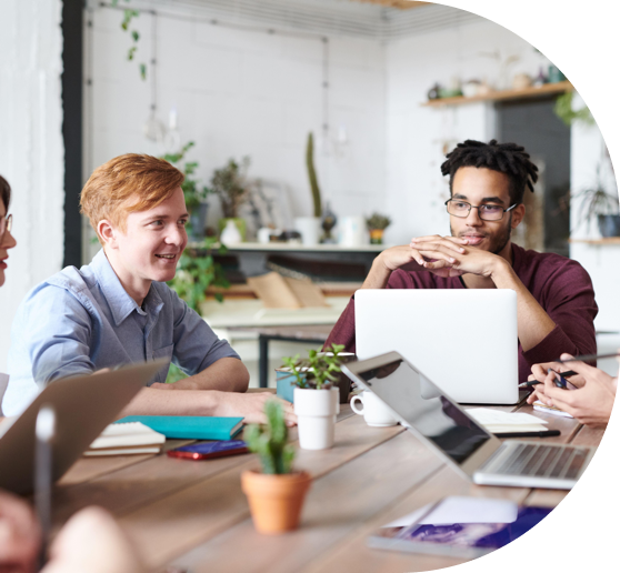 Team of employees collaborating around a meeting table